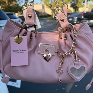 Juicy Couture viral rolling on satchel pink diamond